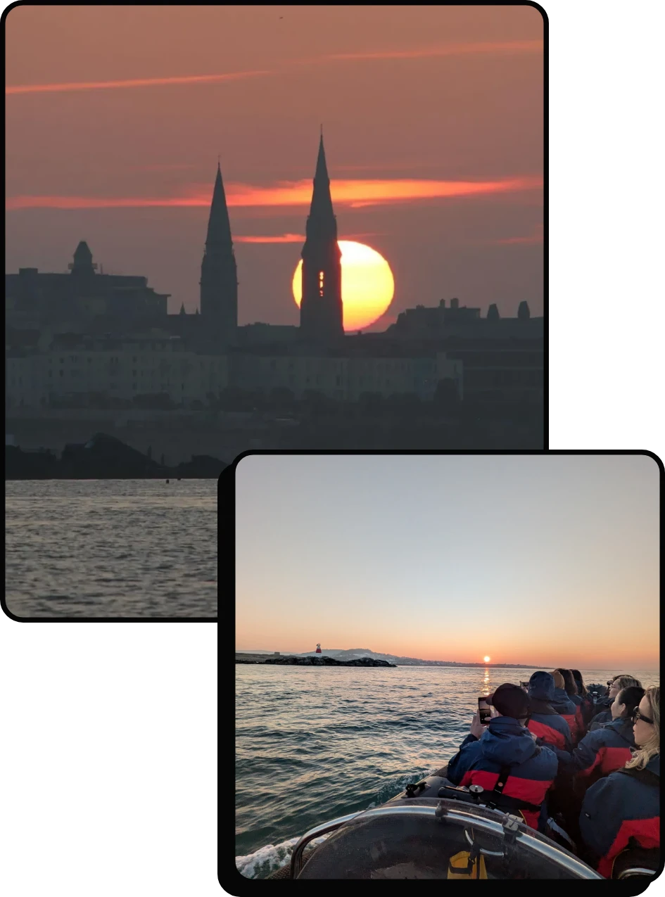 Two photos: The first shows a sunset behind two church spires over a city skyline by the water. The second shows people in a boat, bundled in jackets, watching the sun set over calm water.